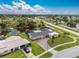 Aerial view of the property shows well-manicured lawn and landscaping in a waterside neighborhood at 2324 Hayworth Rd, Port Charlotte, FL 33952