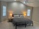 This bedroom has neutral-colored walls, carpet, and a ceiling fan at 2324 Hayworth Rd, Port Charlotte, FL 33952