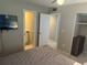This bedroom features multiple entry ways and neutral colored walls at 2324 Hayworth Rd, Port Charlotte, FL 33952