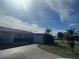 Features include well-maintained landscaping and a tidy exterior view of the single-story home at 2324 Hayworth Rd, Port Charlotte, FL 33952