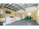 Garage with washer, dryer, utility sink, storage, and garage door mechanics at 2324 Hayworth Rd, Port Charlotte, FL 33952