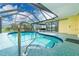 The enclosed pool offers a relaxing retreat with a screened enclosure and scenic water views at 2324 Hayworth Rd, Port Charlotte, FL 33952