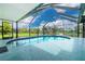 Enjoy a refreshing dip in this lovely enclosed pool with great views at 2324 Hayworth Rd, Port Charlotte, FL 33952