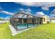 The refreshing enclosed pool is surrounded by a screened lanai and lush greenery, offering privacy and relaxation at 2324 Hayworth Rd, Port Charlotte, FL 33952
