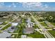 Aerial view of a property in a residential neighborhood, showcasing its location and surrounding environment at 23420 Peachland Blvd, Port Charlotte, FL 33954