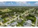 An aerial view highlights the property's proximity to local amenities and green spaces at 23420 Peachland Blvd, Port Charlotte, FL 33954