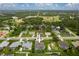 An aerial view showcasing a residential area with well-maintained properties and green spaces at 23420 Peachland Blvd, Port Charlotte, FL 33954