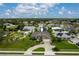An aerial view showcases a well-maintained property in a residential neighborhood at 23420 Peachland Blvd, Port Charlotte, FL 33954