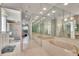 Spacious bright bathroom featuring a large tub, walk-in shower, and double sink vanity with a makeup counter at 23420 Peachland Blvd, Port Charlotte, FL 33954