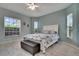 Serene bedroom with tile floors, large windows, and neutral paint at 23420 Peachland Blvd, Port Charlotte, FL 33954