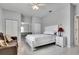 Bedroom featuring a full-sized bed, ceiling fan, and two closets, one with a vanity at 23420 Peachland Blvd, Port Charlotte, FL 33954