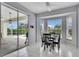 Bright dining area with bay window and sliding door access to the screened lanai at 23420 Peachland Blvd, Port Charlotte, FL 33954