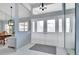 Bright entryway with tiled floor, double doors, and views to dining and living areas at 23420 Peachland Blvd, Port Charlotte, FL 33954