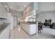 Bright kitchen featuring white cabinetry, modern appliances, and open to the living area at 23420 Peachland Blvd, Port Charlotte, FL 33954