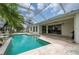 A beautiful screened-in pool with a built-in grill at 23420 Peachland Blvd, Port Charlotte, FL 33954