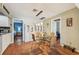 Cozy kitchen nook with glass table, with access to multiple rooms, perfect for casual dining at 2507 Mooring Ln, Sarasota, FL 34231