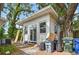 Outdoor shed with modern windows and siding in a backyard setting, surrounded by greenery at 2507 Mooring Ln, Sarasota, FL 34231