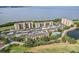 Beautiful aerial view of condo community featuring lush greenery and waterfront views at 2615 Cove Cay Dr # 409, Clearwater, FL 33760
