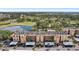 Stunning aerial view of condo complex overlooking lush green golf course and tranquil lake at 2615 Cove Cay Dr # 409, Clearwater, FL 33760