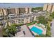 Gorgeous aerial of condo buildings with pool, tennis court, and easy parking at 2615 Cove Cay Dr # 409, Clearwater, FL 33760