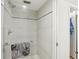 Modern bathroom features glass enclosed shower with gray tile and updated fixtures at 2615 Cove Cay Dr # 409, Clearwater, FL 33760