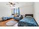 The bedroom has hardwood floors, a ceiling fan and a window with natural light at 2615 Cove Cay Dr # 409, Clearwater, FL 33760