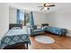 The bedroom has hardwood floors, a ceiling fan and a window with natural light at 2615 Cove Cay Dr # 409, Clearwater, FL 33760