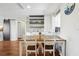 Dining area with a hardwood table and chairs, complemented by rustic wall decor at 2615 Cove Cay Dr # 409, Clearwater, FL 33760