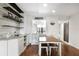 The dining room features a wood floor, a wooden table with four chairs, and built in shelves and cabinets at 2615 Cove Cay Dr # 409, Clearwater, FL 33760