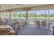 Bright dining room featuring views of the water and tropical landscaping at 2615 Cove Cay Dr # 409, Clearwater, FL 33760