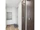 Bright entryway with built in cabinet, bench seat, and coat rack at 2615 Cove Cay Dr # 409, Clearwater, FL 33760