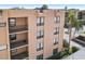 Exterior view of a multi-story residential building with multiple balconies at 2615 Cove Cay Dr # 409, Clearwater, FL 33760