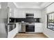 This remodeled kitchen is modern, and features stainless steel appliances, and beautiful granite counters at 2615 Cove Cay Dr # 409, Clearwater, FL 33760