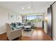 Bright living room featuring hardwood floors and barn door at 2615 Cove Cay Dr # 409, Clearwater, FL 33760