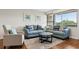 Cozy living room featuring stylish furniture, hardwood floors, and natural light at 2615 Cove Cay Dr # 409, Clearwater, FL 33760