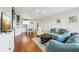 Open living room featuring hardwood floors, stylish furniture, and a dining area at 2615 Cove Cay Dr # 409, Clearwater, FL 33760