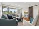 Comfortable living room with a large window, hardwood floors, and a sliding barn door at 2615 Cove Cay Dr # 409, Clearwater, FL 33760