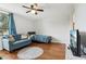 Cozy living room with hardwood floors, ceiling fan, and natural light at 2615 Cove Cay Dr # 409, Clearwater, FL 33760