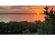 Breathtaking sunset view overlooking the tranquil water and bridge at 2615 Cove Cay Dr # 409, Clearwater, FL 33760