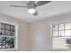 Bedroom featuring ceiling fan, two windows, and neutral paint at 2728 58Th S St, Gulfport, FL 33707
