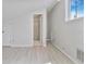 Cozy bedroom featuring light grey wood-look floors and a nearby bathroom at 2728 58Th S St, Gulfport, FL 33707