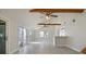 Bright living space features vaulted ceilings, wood beams, an open layout, and sliding glass doors at 2728 58Th S St, Gulfport, FL 33707