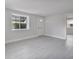 Bright and airy living room featuring modern flooring, a large window, and natural light at 2728 58Th S St, Gulfport, FL 33707