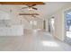 Inviting living area features vaulted ceilings with wood beams and an open layout to the updated kitchen at 2728 58Th S St, Gulfport, FL 33707