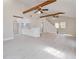 Bright, open living space with high ceilings, exposed wooden beams, tile flooring, and a seamless flow to the modern kitchen at 2728 58Th S St, Gulfport, FL 33707