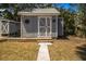 Backyard shed with decorative stars and double doors offers ample storage at 2728 58Th S St, Gulfport, FL 33707