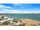 Expansive waterfront view showcasing a tranquil bay dotted with sailboats under a clear blue, partly cloudy sky at 2728 58Th S St, Gulfport, FL 33707