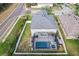 The aerial view captures the backyard with a pool and the home's position within a landscaped neighborhood at 3046 Donington Castle Ln, Land O Lakes, FL 34638