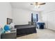 Cozy bedroom with closet and window, featuring a playful tent for children, perfect for a young  at 3046 Donington Castle Ln, Land O Lakes, FL 34638