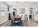 Elegant dining room featuring a stylish table with seating for six and modern light fixtures at 3046 Donington Castle Ln, Land O Lakes, FL 34638